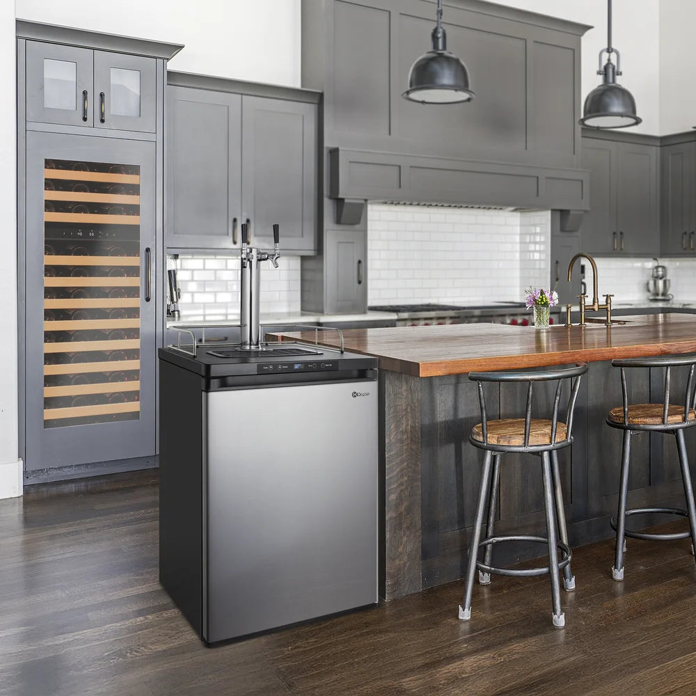 Stainless steel door Kegco K309 Keg Beer Refrigerator placed at the end of a wood island in a grey kitchen