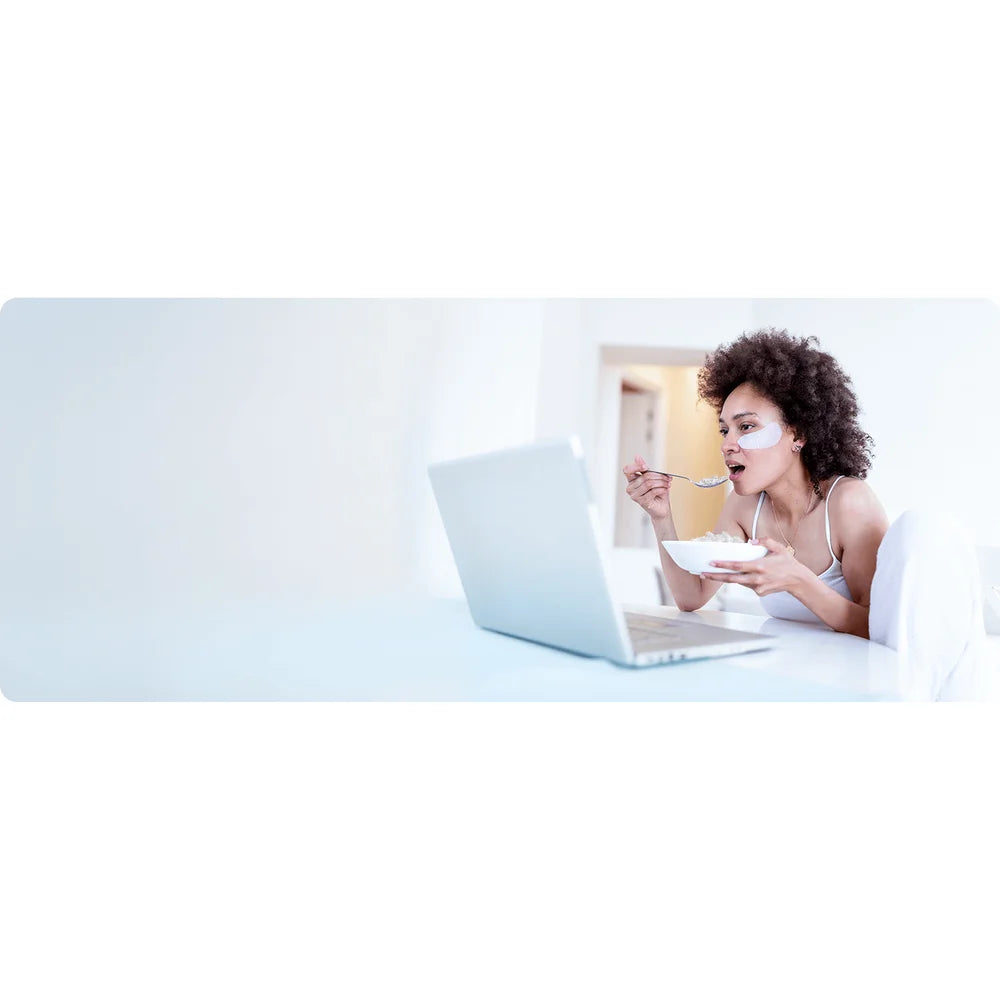 Woman enjoying a bowl of soft chewable nugget ice from the Kismile Z5815NH Nugget Ice Maker at home